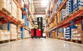Worker In Forklift In Warehouse