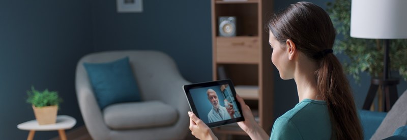 A patient attending a video appointment with a doctor.