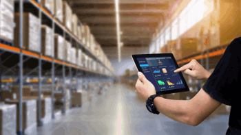 Image of Warehouse management employee using WMS on a mobile tablet to do stock check