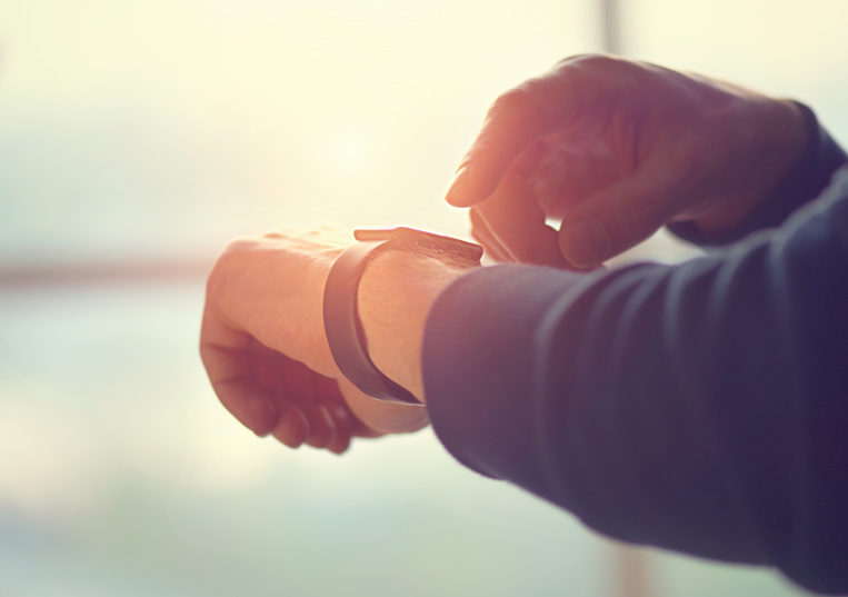 person wearing a personal safety watch