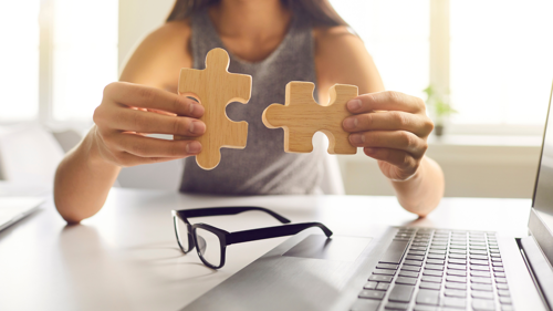 A woman sorting out a jigsaw puzzle 