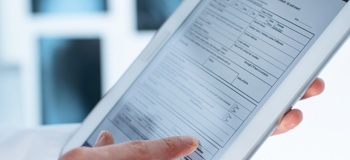 A tablet device displaying a medical form. Such forms can automatically be filled by Access NotesCentre.