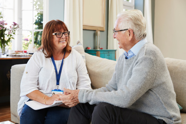 A community care worker with a client.