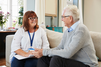 A community care worker with a client.