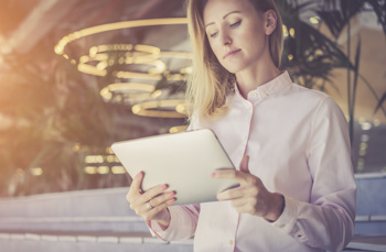 Women looking at Access Financials on iPad