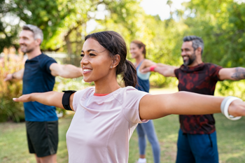 people taking part in a yoga class outside