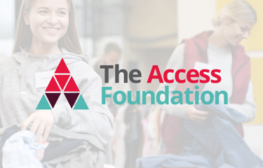 Two women sorting clothes at a donation event, with ‘The Access Foundation’ logo in the foreground