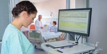 Nurse using digital software