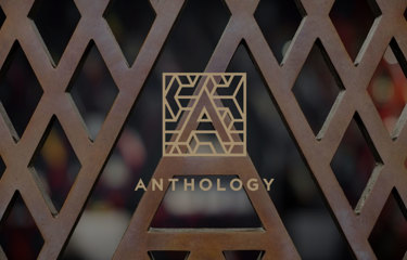 Geometric letter A logo with the word ‘Anthology’ below, set against a patterned background