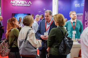 The Access Group's stand at lunchtime, with staff talking to prospective customers.