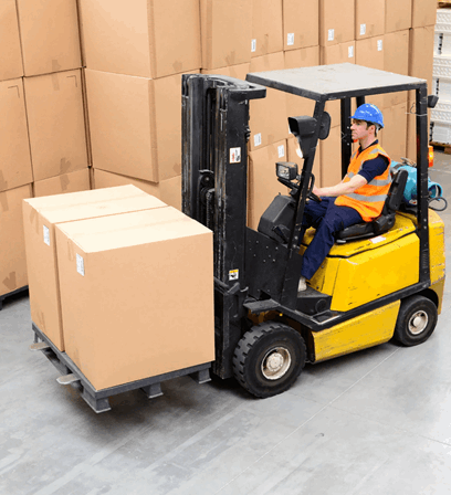 Man In Warehouse Driving Forklift