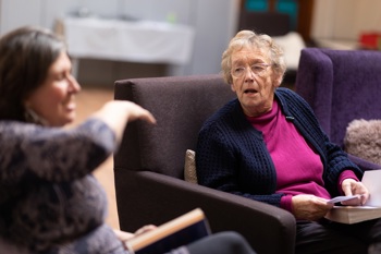 An elderly woman in a care home.