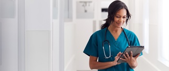 A nurse using electronic patient records.