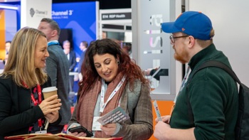 Access Group talking to people on stand at Rewired 2025