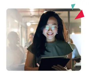 image of happy woman looking at tablet in an office environment