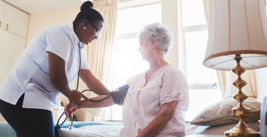 A nurse visiting a virtual ward patient due to a deterioration in condition.