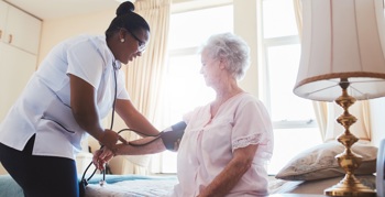 A nurse visiting a virtual ward patient due to a deterioration in condition.