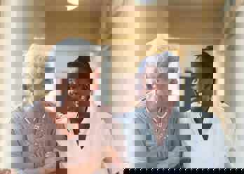 A carer smiling with a care recipient