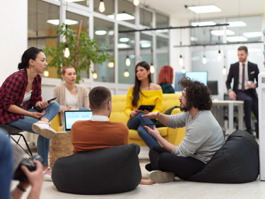 A group of young people having a group discussion