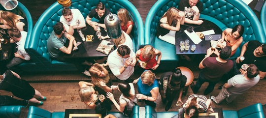 A room full of people at a restaurant 