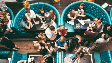 A room full of people at a restaurant 