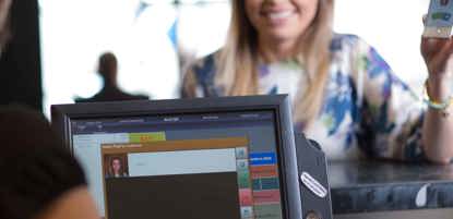 A woman ordering at a till