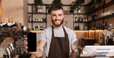 A waiter smiling 
