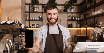 A waiter smiling 
