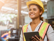 female construction worker holding clipboard