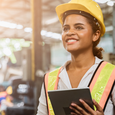 female construction worker holding clipboard