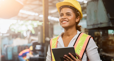 female construction worker holding clipboard
