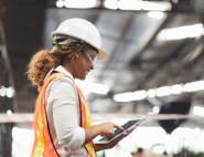 Female warehouse worker on tablet device