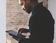 Man using iPad tablet device