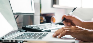 A clinician working on integrated healthcare software.