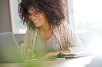 Women look at cloud accounting software on screen