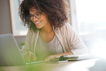 Women look at cloud accounting software on screen