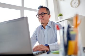 Man working on his laptop in office