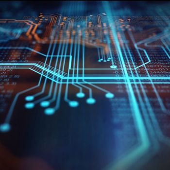  Glowing blue and orange circuit lines on a dark background, representing digital connectivity