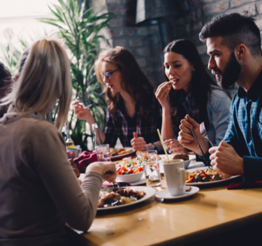 group of customers eating in a restaurant setting