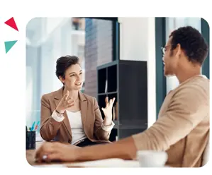 A manager and employee in a one-to-one, informal coaching conversation