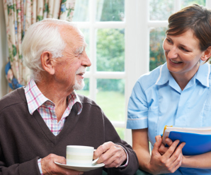 Carer with elderly man. 