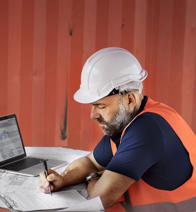 Construction manager using software on site