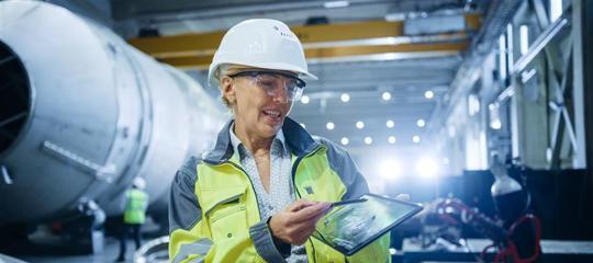 Lady with tablet in warehouse
