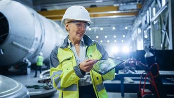 Lady with tablet in warehouse
