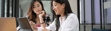 Employees having a discussion in office