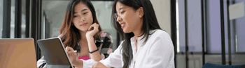 Image of employees in the office discussing
