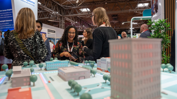 Access staff and customers engaging over neighbourhoods demo map at rewired 2026