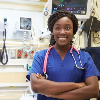 A black woman nurse smiling 