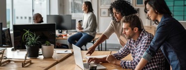 People around a laptop
