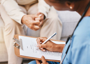doctor taking patient notes